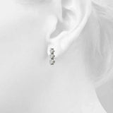 platinum three stone diamond earrings