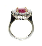 white gold ring with Burmese ruby that is prong set in yellow gold with diamonds