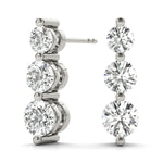 platinum three stone diamond earrings