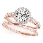 rose gold diamond halo engagement ring and rose gold diamond wedding band