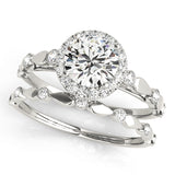 white gold halo engagement ring and white gold diamond wedding band
