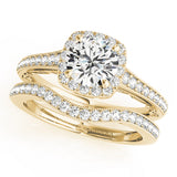 yellow gold vintage inspired halo engagement ring and yellow gold curved diamond wedding band