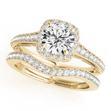 yellow gold curved diamond wedding band and yellow gold vintage inspired halo engagement ring