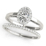 platinum oval halo engagement ring and single row diamond wedding band