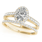 yellow gold single row diamond wedding band and yellow gold oval halo engagement ring