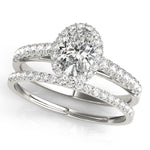 white gold oval halo engagement ring and white gold single row diamond wedding band