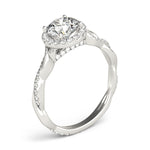 white gold round halo diamond engagement ring with a twisted shank