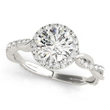 white gold round halo diamond engagement ring with a twisted shank