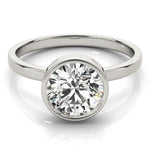 white gold bezel set diamond solitaire engagement ring