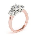 rose gold three stone diamond engagement ring with white gold prongs