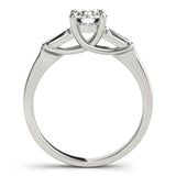 white gold three stone diamond engagement ring with baguettes and a round center diamond
