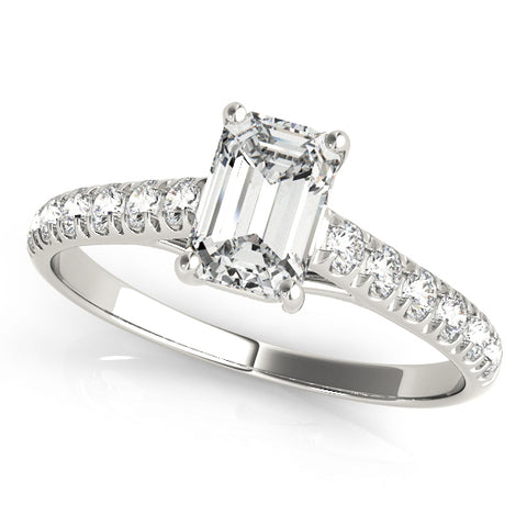 platinum single row diamond engagement ring with an emerald cut diamond