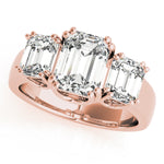 rose gold three stone emerald cut engagement ring