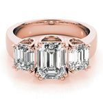 rose gold three stone emerald cut engagement ring