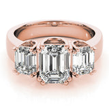 rose gold three stone emerald cut engagement ring