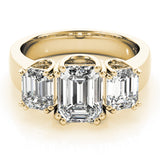 yellow gold three stone emerald cut engagement ring 