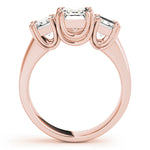 rose gold three stone emerald cut engagement ring