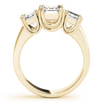 yellow gold three stone emerald cut engagement ring 