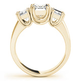 yellow gold three stone emerald cut engagement ring 