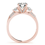 rose gold three stone diamond accented engagement ring