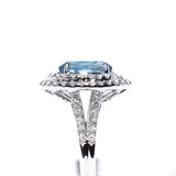 18kt white gold blue topaz ring with a double halo of diamonds 