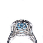 18kt white gold blue topaz ring with a double halo of diamonds 
