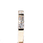 14kt yellow gold diamond ring, alternating baguette diamonds and princess cut diamonds