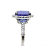 14kt white gold tanzanite and diamond halo ring