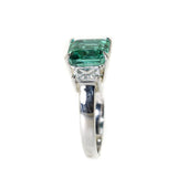 platinum emerald and diamond three stone ring