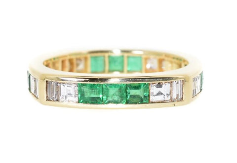 yellow gold diamond and emerald eternity ring