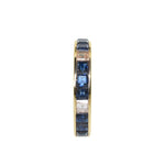yellow gold blue sapphire and diamond eternity ring