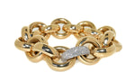 yellow gold handmade link bracelet with diamonds that accent one white gold link
