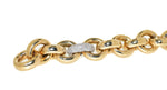 yellow gold handmade link bracelet with diamonds that accent one white gold link