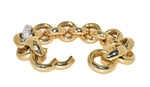 yellow gold handmade link bracelet with diamonds that accent one white gold link
