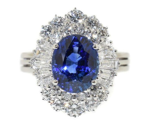 white gold ring with an oval Ceylon blue sapphire with a diamond halo