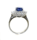 white gold ring with an oval Ceylon blue sapphire with a diamond halo