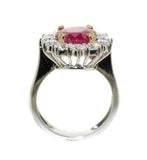 white gold ring with Burmese ruby that is prong set in yellow gold with diamonds