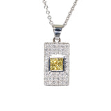 white gold diamond and yellow sapphire pendant