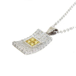 white gold diamond and yellow sapphire pendant