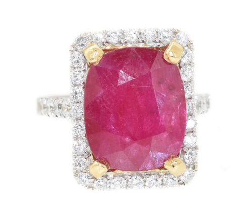 white gold ring with yellow gold prongs and diamond halo