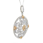 white gold and yellow gold diamond floral circle pendant