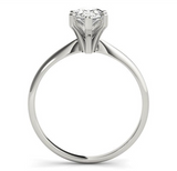 white gold solitaire engagement ring with a pear shaped diamond