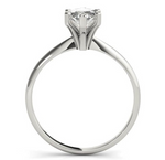 white gold solitaire engagement ring with a marquise diamond