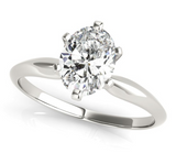 white gold solitaire engagement ring with an oval diamond